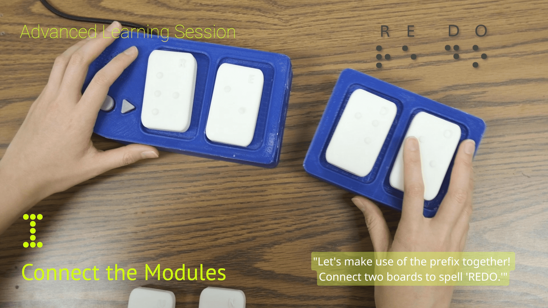 Two hands bringing a second board toward the first to spell REDO